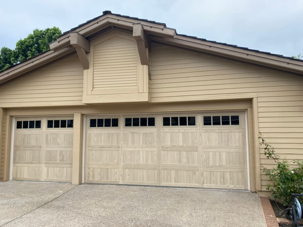 Black modern flush garage door with side windows, Point Loma