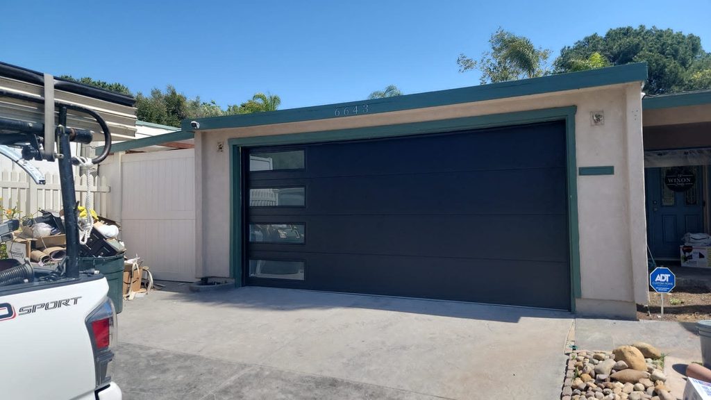 Black flush garage door with windows, Serra Mesa