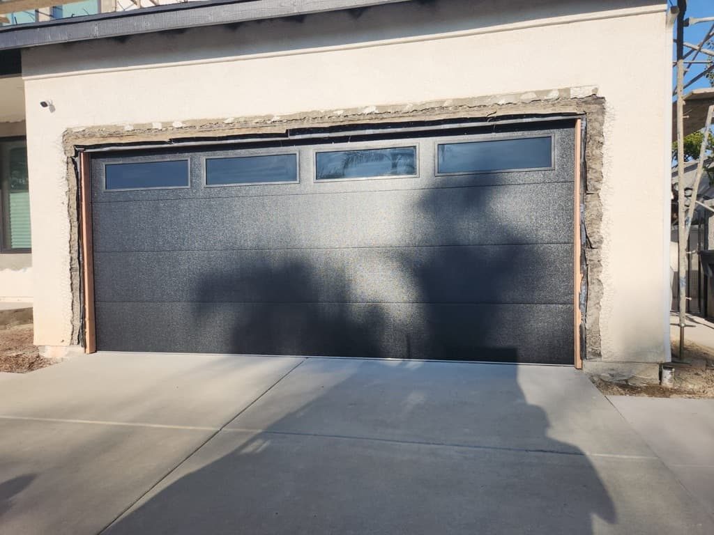 Cedar horizontal-slat garage door with black side windows, Linda Vista