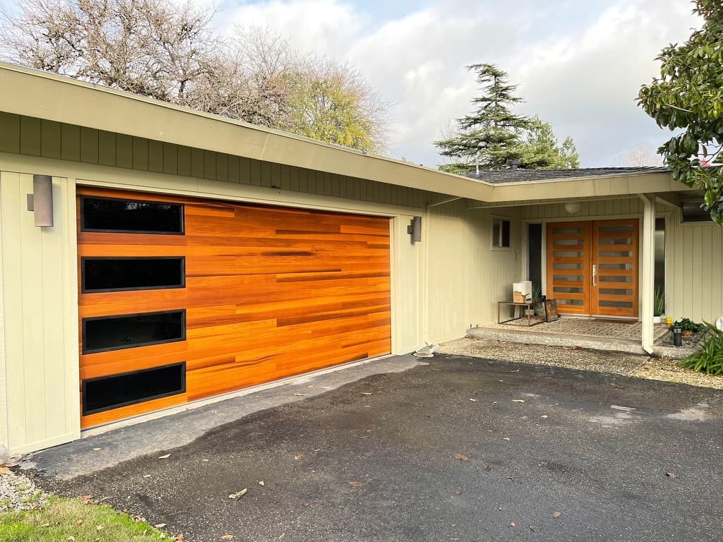 Dark walnut long-panel garage door with windows, Pacific Beach