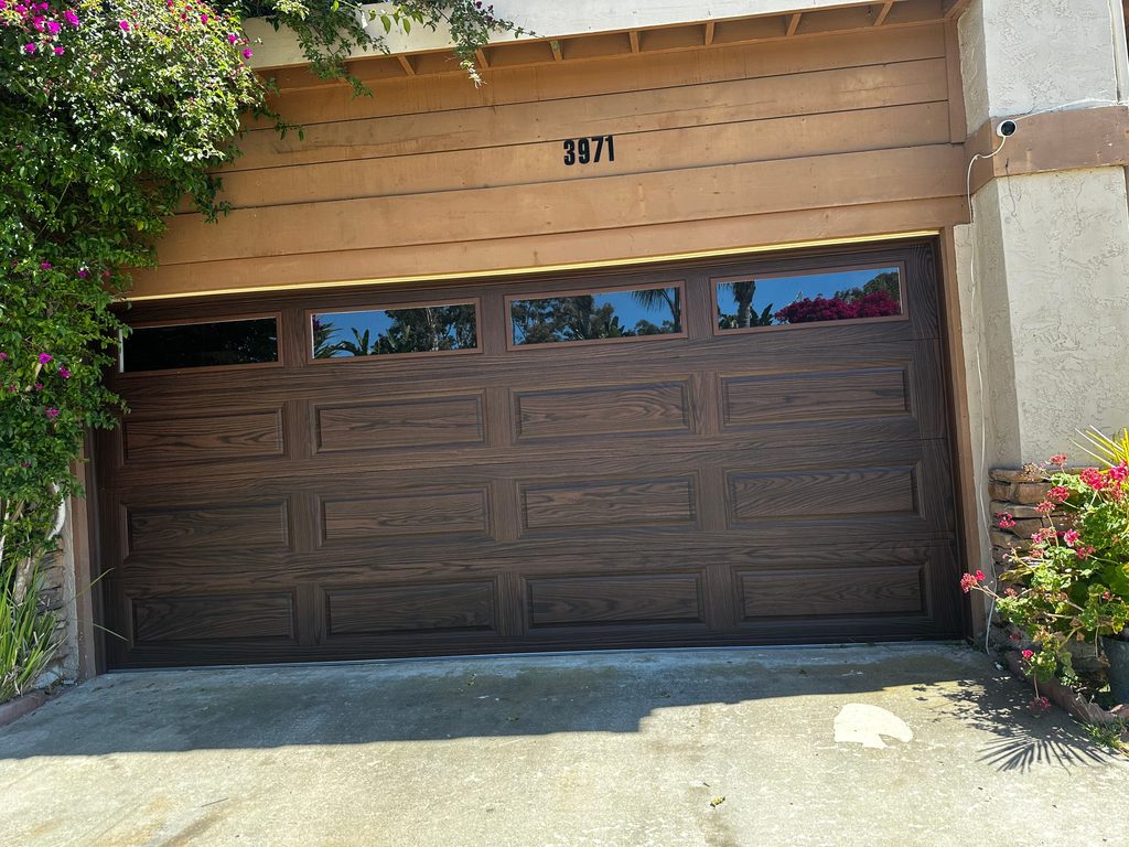 Walnut wood-look long-panel garage door with windows, Pacific Beach