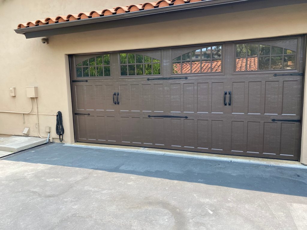 White carriage-style garage door with arched windows, Oceanside