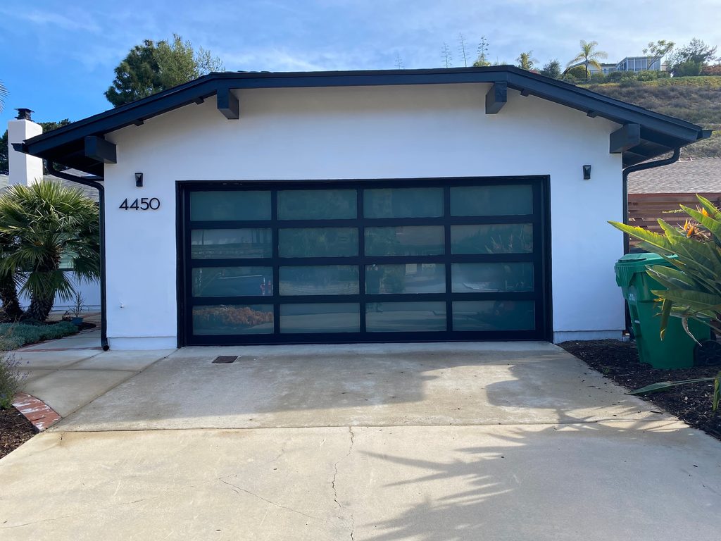 White full-view garage door on a farmhouse, San Diego